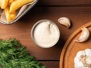 white sauce in a metal sauce pan, photo for restaurant menu