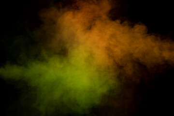 Yellow and green steam on a black background.
