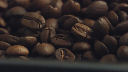 Roasted coffee beans filling frame, a close up