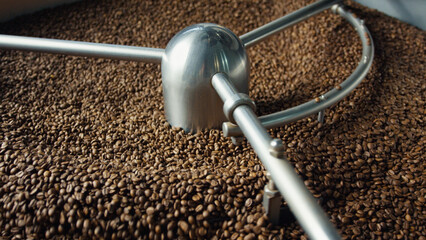 Coffee beans roasting in a large industrial