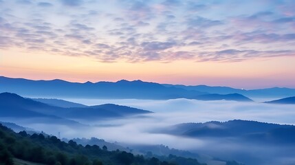 Fototapeta premium A subtle sunrise scene of soft blue and pink sky over the Carpathians, layers of mountains fading into the mist, the sun barely peeking above the horizon, creating a peaceful mood.