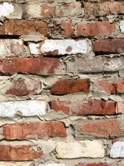 Obraz premium Close-up view of a weathered brick wall with unique colors