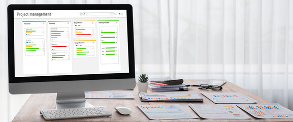 Project planning software for brisk business project management on the computer screen showing...