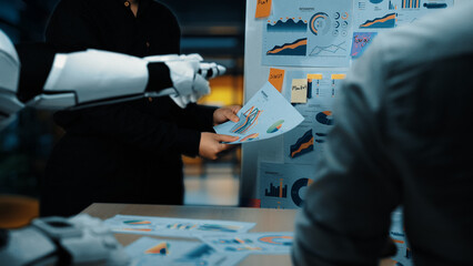 A modern office setting highlights a robotic arm assisting in a business meeting by presenting data...
