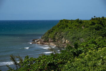 Contemporary-styled Aguadilla ruins by the sea in Puerto Rico, featuring beach views, ocean scenery, and a dog by the shore.