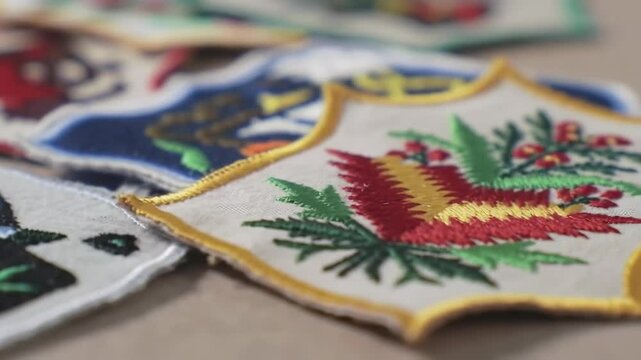 Assorted colorful embroidered decorative patches close up texture