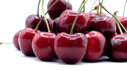 close up of beautiful red cherries on white background