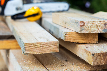 chainsaw out of focus, pine planks for chainsaw tickets