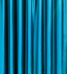 blue satin theater drapes or stage curtains, full frame, evoking elegance, drama, and luxury....