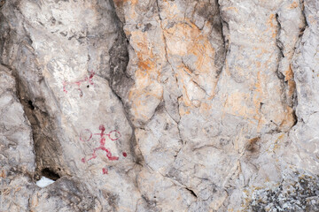 A rock with two drawings on it