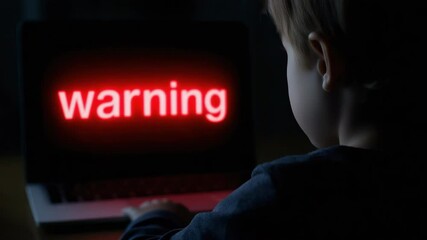 Child engaged with glowing warning screen in dark room