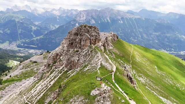 11 july 2024, Rotwandh&uuml;tte, Italy. Aerial, forward drone flight near Rotwandh&uuml;tte ( Rifugio Roda di Va&egrave;l). Hikers on the hiking trails and small peak around the mountain hut. Wonderful hiking destinat
