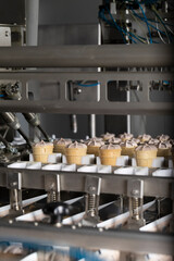 Close-Up of Automated Ice Cream Cone Filling Machine – Industrial Food Production