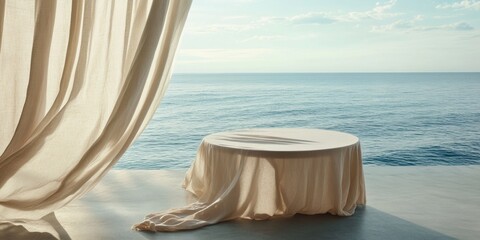 Serene coastal scene featuring a draped table by the sea, perfect for wedding, event planning, or hospitality imagery.