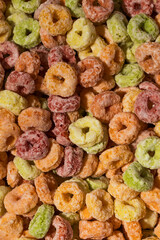  Full frame photo of round multicolored cereals, top view. Breakfast cereal concept.