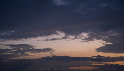 The sky is dark and cloudy with a few clouds scattered throughout