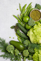 Fresh green vegetables in assortment top view, free space for copy. Healthy lifestyle, detox, flat lay.