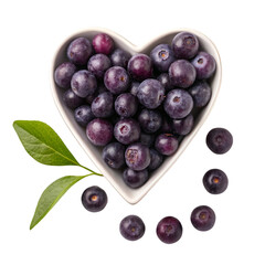 Acai berries in heart-shaped bowl on white background