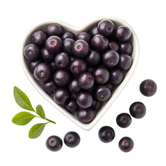 Acai berries in heart-shaped bowl on white background