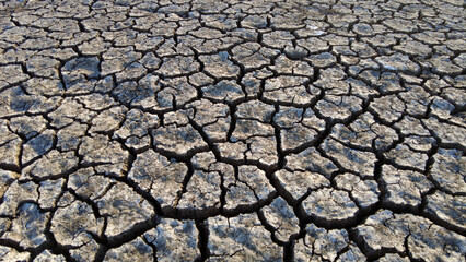 broken and cracked lands caused by drought, lands split open by thirst,