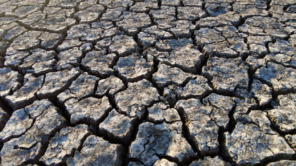 broken and cracked lands caused by drought, lands split open by thirst,