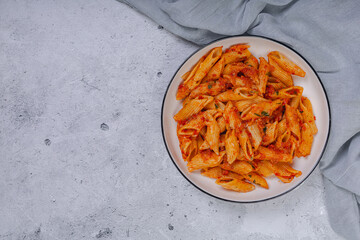 Pasta spaghetti Bolognese with red tomato souse on white plate on isolated white background.