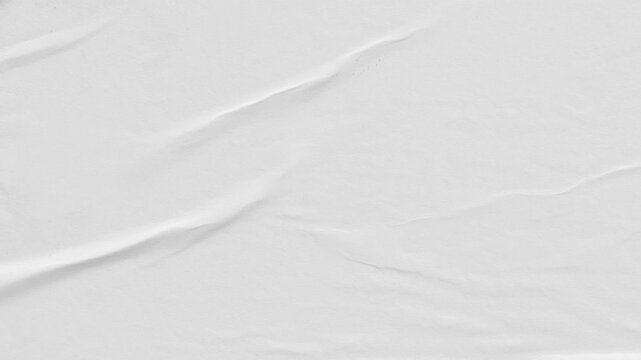 Abstract white wrinkled paper texture with gentle creases and subtle shadows