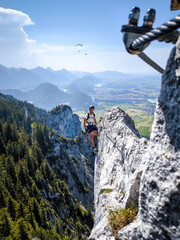 Climber On Fingersteig Via Ferrata Near Tegelberg: Adventurer Traversing Narrow Ridge With Harness And Helmet Against A Stunning Alpine Backdrop In Bavaria, Germany
