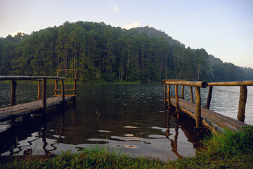 Bamboo dock by calm forest lake, Rustic bamboo pier on mountain lake, Adventure spot with nature campsite, Bamboo dock at Pang Oung, Thailand
