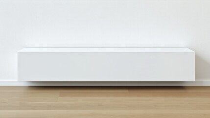 White low-profile console against a white wall.