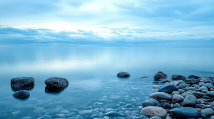 serene coastal landscape with smooth rocks and calm blue water
