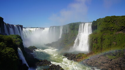 Stunning views of Iguazu Falls captured from various angles, showcasing the immense power, mist, and natural beauty of this iconic South American wonder