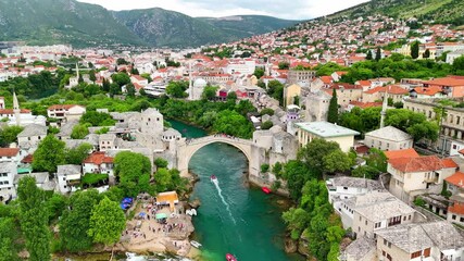 Aerial drone view of the Old Town and the Old Bridge in Mostar, Bosnia and Herzegovina. Panoramic view of the historic town and Neretva river. - Powered by Adobe