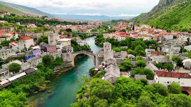 Aerial drone view of the Old Town and the Old Bridge in Mostar, Bosnia and Herzegovina. Panoramic view of the historic town and Neretva river.
