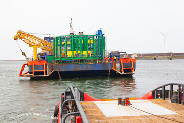 Sea towing of a non-self-propelled barge.
