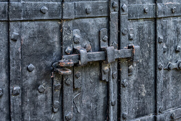 Antique iron door in the old brick wall.