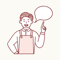 Smiling man wearing an apron points upward, seemingly having a great idea or thought