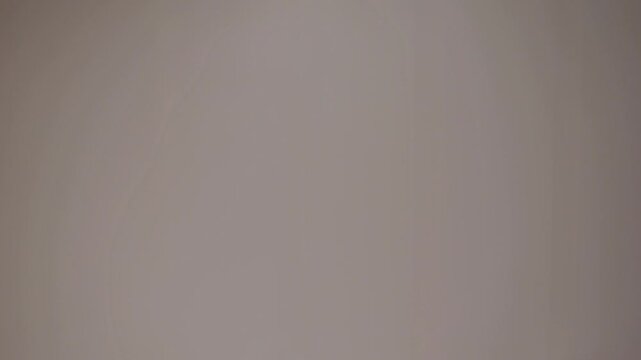 Single finger raised in an upward gesture signaling importance or direction during a discussion