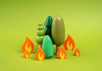 Forest on fire. Figures of trees and fire. Saving forests from fires. Controlled fires for forest health. An ecological rethink of forest fires. Need for ecological awareness, fire prevention