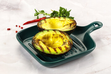 Sliced fresh avocado on the grill