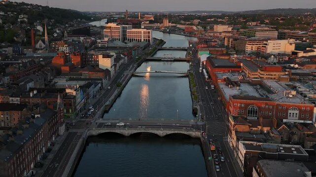 Golden hour over Cork's River Lee illuminates the city's charm and beauty