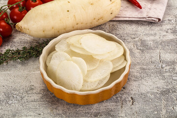 Sliced white daikon radish in the bowl