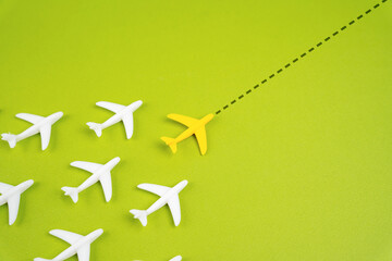 The planes fly behind the leader along the extended course. Aviation and passenger transportation. Leadership concept. Aviation industry coordination, and strategic direction in air transport.