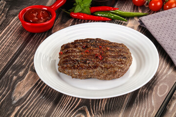 Grilled beef burger cutlet with sauce