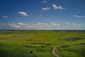 A drone view of agricultural green and yellow fields, panoramic landscape.