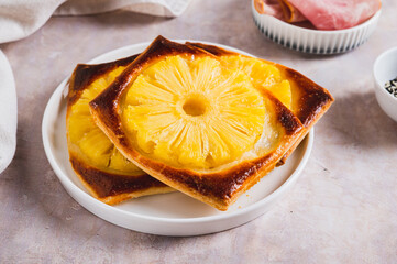 Sweet homemade pineapple tarts on a plate on the table