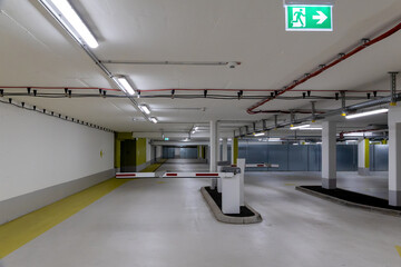 Underground parking with exit sign and barrier