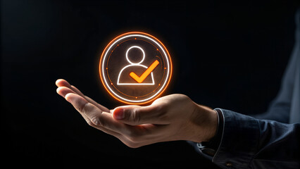 Hand holding a person icon with a check mark symbolizing validation and approval