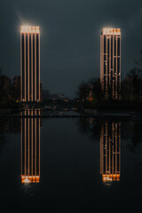 Reflection of two skyscrapers in big city