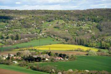 Obraz premium Rural Spring Blossom: Agricultural Fields, Village Scene, Family Homes, Easter in Hungary, Vineyards, Forest Landscape, Pastoral Scenery, Springtime, Blooming Trees, Flowing Stream, Traditional